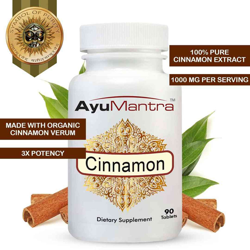 AyuMantra Cinnamon dietary supplement bottle with cinnamon sticks and leaves on a white background