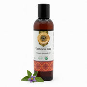 Bottle of Dashmool Bala Organic Ayurvedic Oil with a white background