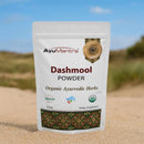 AyuMantra Dashmool Powder packaging on a desert background