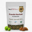 AyuMantra Erenda Haritaki Powder packaging with herbs on a white background