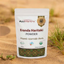 AyuMantra Erenda Haritaki Powder packaging on a desert background