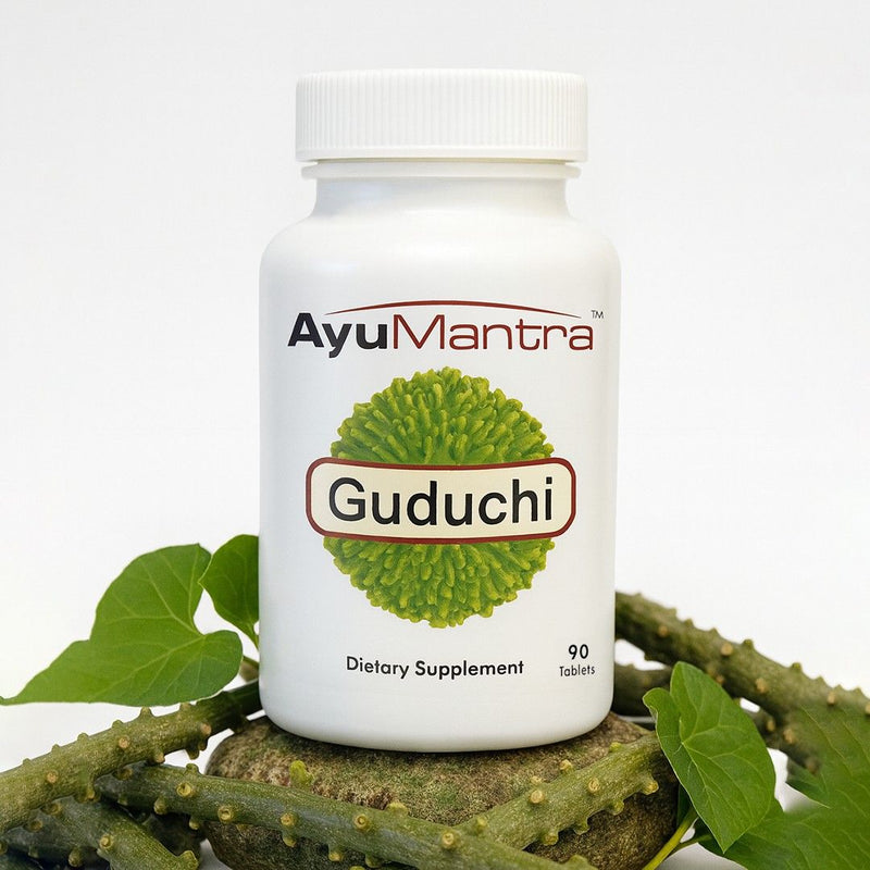 AyuMantra Guduchi dietary supplement bottle with green leaves on a white background.