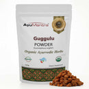 AyuMantra Guggulu Powder packaging with herbs on a white background