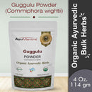 Package of AyuMantra Guggulu Powder with branding and product details on a light background