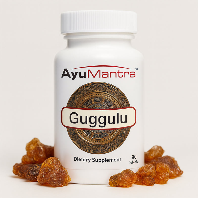 AyuMantra Guggulu dietary supplement bottle with guggulu tablets on a white background.