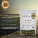 AyuMantra Gurmar Powder packaging with product details on a textured surface