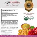 AyuMantra Japakusumadi Oil packaging with ingredients list, organic certification logos, and product details.