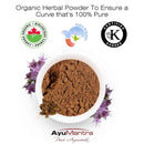 Organic herbal powder in a white bowl with certification logos and AyuMantra branding.
