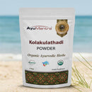 AyuMantra Kolakulathadi Powder packaging on a beach background