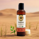 Ksheerbala organic ayurvedic oil bottle with a desert background