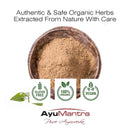 Wooden bowl with brown powder, surrounded by organic certification logos and AyuMantra branding.