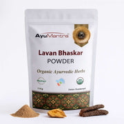 AyuMantra Lavan Bhaskar Powder packaging with herbs on a white background