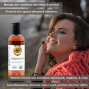 Woman with a red scarf and a bottle of AvuMaa Ayurvedic oil against a blurred natural background.