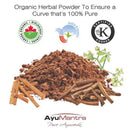 Organic herbal powder with AyuMantra branding and certification logos on a white background
