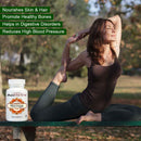 Woman practicing yoga outdoors with AyuVitro Moringa supplement bottle in foreground