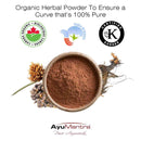 Organic herbal powder in a bowl with certification logos and AyuMantra branding on a white background.