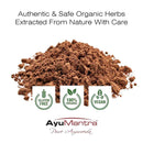 Brown powder with AyuMantra branding and certification logos on a white background