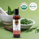 Bottle of Neem oil with USDA Organic and OneCert Organic certification logos on a green background.