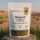 AyuMantra Nirgundi Powder packaging with a desert landscape in the background