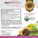 AyuMantra Panchaguna Oil packaging with ingredients list, organic certification logos, and natural product imagery.