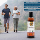 Two people jogging outdoors with a bottle of Panchaguna Organic Ayurvedic Oil in the foreground.