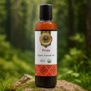 Bottle of Pinda Organic Ayurvedic Oil on a natural background