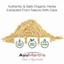 Pile of organic herbs with AyuMantra branding and certification logos on a white background