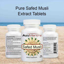 AyuMantra Safed Musli dietary supplement bottles on a sandy background with text about Pure Safed Musli Extract Tablets.