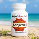 AyuMantra Sanjivani dietary supplement bottle on a beach with ocean in the background
