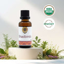 Bottle of Shadbindu with USDA Organic and OneCert labels on a natural background