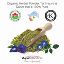 Green herbal powder with a wooden scoop, surrounded by blue flowers and leaves, on a white background with certification logos above.