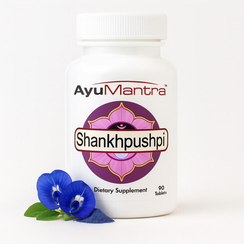 AyuMantra Shankhpushpi dietary supplement bottle with a blue flower on a white background