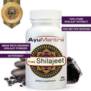 AyuMantra Shilajit pills bottle with purity badge and stones, organic Shilajit extract supplement image