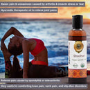 Woman stretching by a body of water with an Ayurvedic therapeutic oil bottle labeled 'Shoolhar' in the foreground.