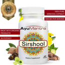 Close-up of AyuMantra Sirshool Tablets bottle with organic multi-herb extract ingredients around it.