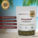 AyuMantra Sitopaladi Powder packaging with product details and branding on a scenic background.
