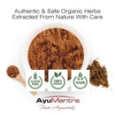 Organic herbs with a bowl of powder, wooden spoon, and AyuMantra branding on a white background.