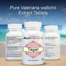 Three Ayumantra Tagar tablets bottles on a beach showing extract tablets and supplement facts.