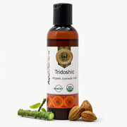 Bottle of Avumenta Tridoshic Organic Ayurvedic Oil with ingredients on a white background