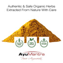 Turmeric powder with AyuMantra branding and certification logos on a white background
