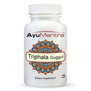 Front view of AyuMantra Triphala Guggul tablets bottle showing the mandala label on a white background.