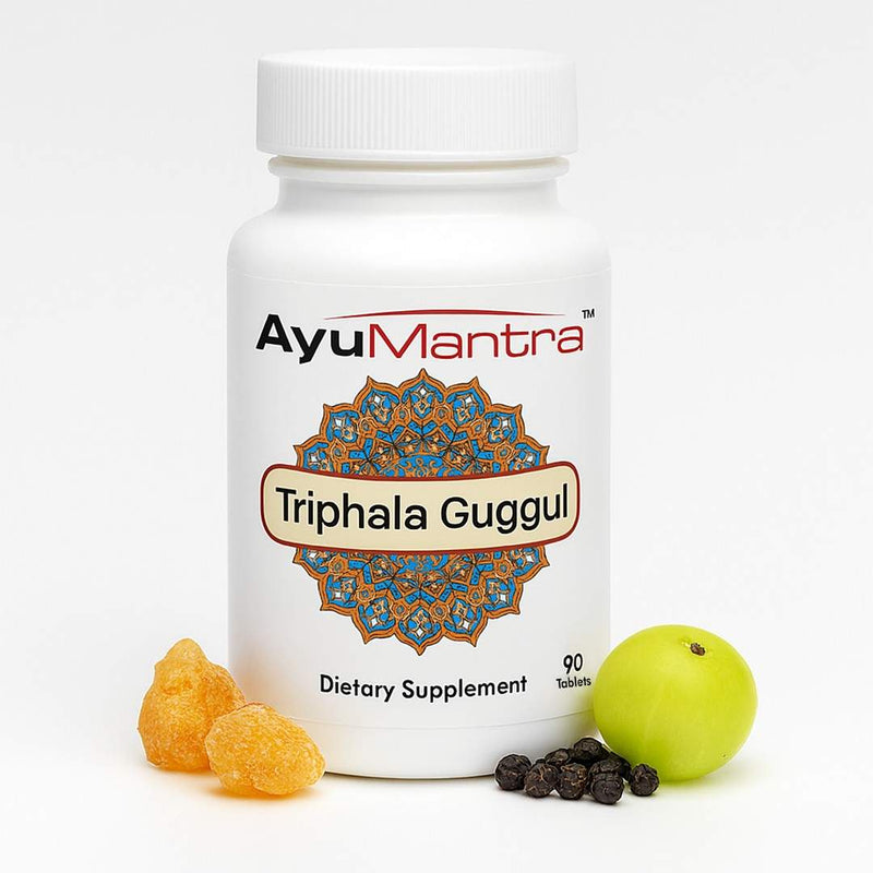 AyuMantra Triphala Guggul tablets bottle on white background with guggul resin, black pepper and amla.