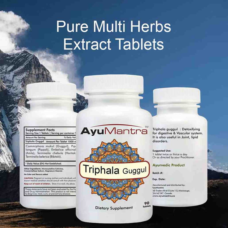 AyuMantra Triphala Guggul tablets front and back bottles with supplement facts text over a mountain scene.