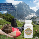 Lifestyle photo of AyuMantra Triphala tablets beside a relaxed person in a mountain landscape