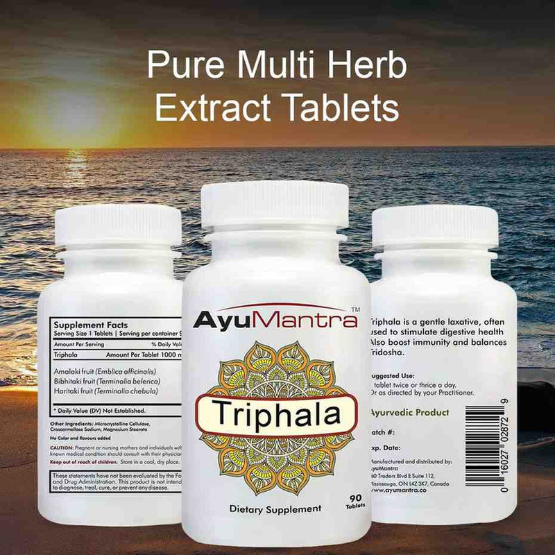 Three AyuMantra Triphala tablets bottles showing front and back labels with multi herb extract text.