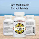 AyuMantra Trishala tablets front and back bottles on a beach showing supplement facts.