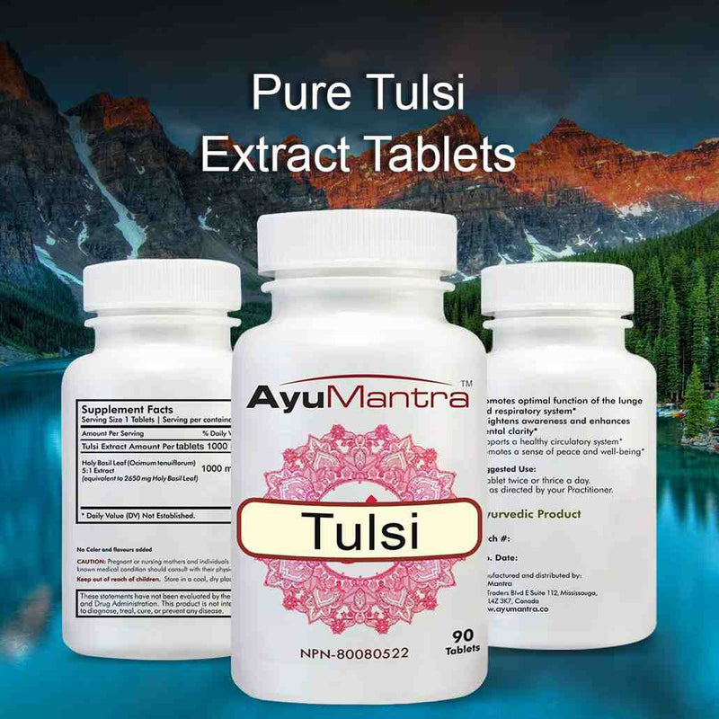AyuMantra Tulsi extract tablets three-bottle set with supplement facts against a mountain lake backdrop.