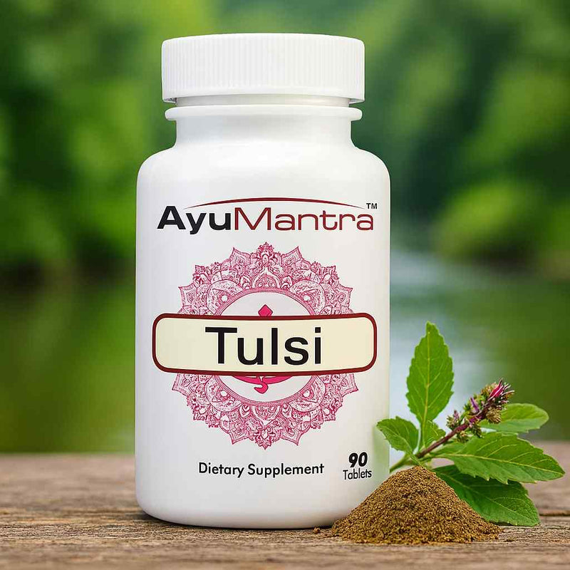 AyuMantra Tulsi holy basil tablets bottle with fresh tulsi sprig and powder by a riverside.