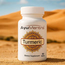 Ayumantra Turmeric tablets bottle on warm desert sand, Curcuma longa dietary supplement.