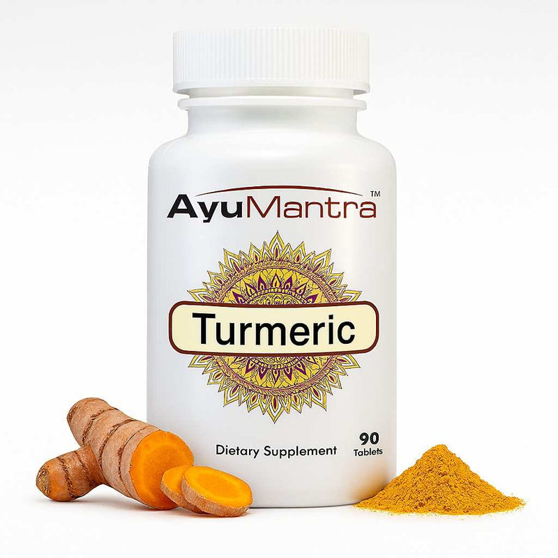 Ayumantra Turmeric tablets bottle with Curcuma longa root slices and bright yellow powder.